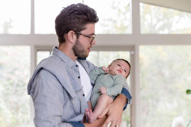 istock New dad comforts baby boy 1209896686