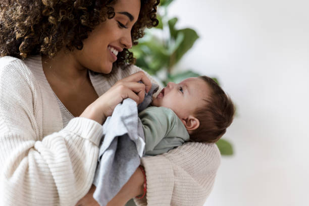 istock New mom cares for her baby boy 1209896699