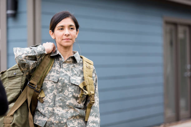 istock Determined mid adult female soldier leaves for deployment 1209896788