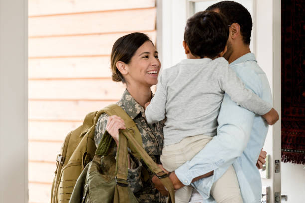 istock Mother is happy to see family after deployment 1209896845
