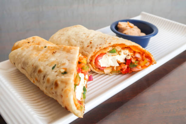 Chapati wrap with cheese, vegetarian food stock photo