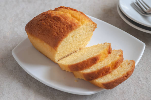 istock Butter cake loaf or pound cake sliced on plate 1209899243