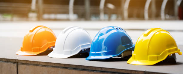 Multicolored Safety Construction Worker Hats. Teamwork of the construction team must have quality. Whether it is engineering, construction workers. Have a helmet to wear at work. For safety at work. stock photo