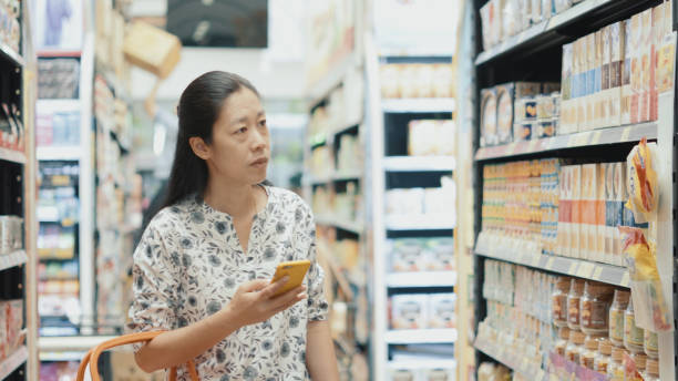 istock Woman finding product inside supermarket 1209902449