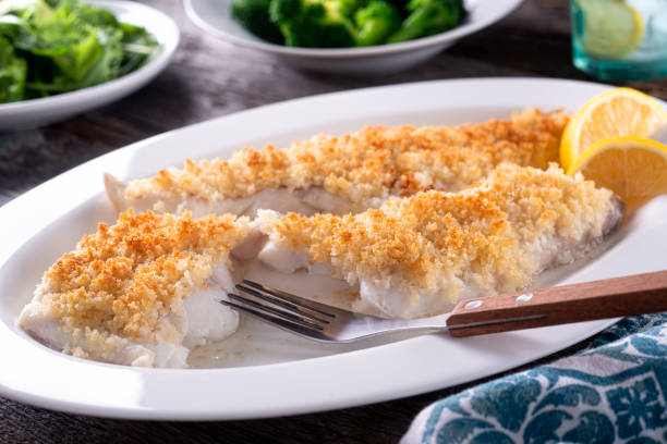 Oven Baked Panko Crusted Fish Fillets Delicious oven baked panko crusted fish fillets. breaded photos stock pictures, royalty-free photos & images