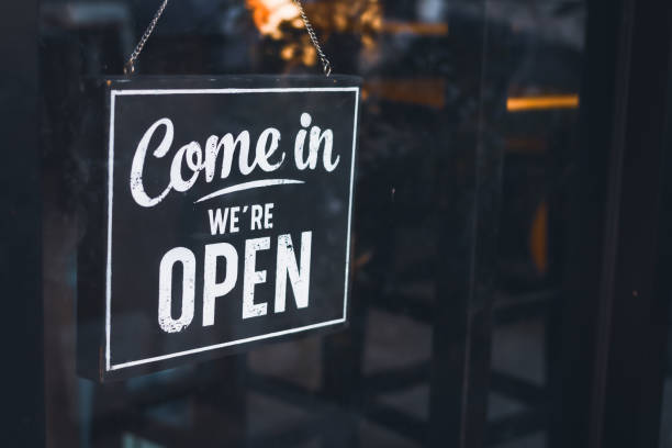 istock Welcome open sign on door .vintage tone. 1209904032