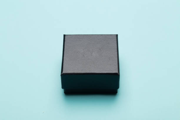 istock Mini black box product packaging isolated on blue background 1209904043