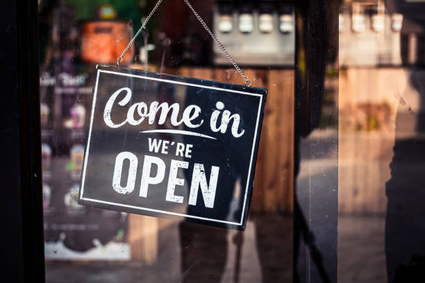 istock Come in we're open, vintage black retro sign in cafe front 1209904048