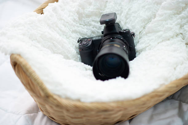 istock The black camera is well placed in a white cloth. 1209904315
