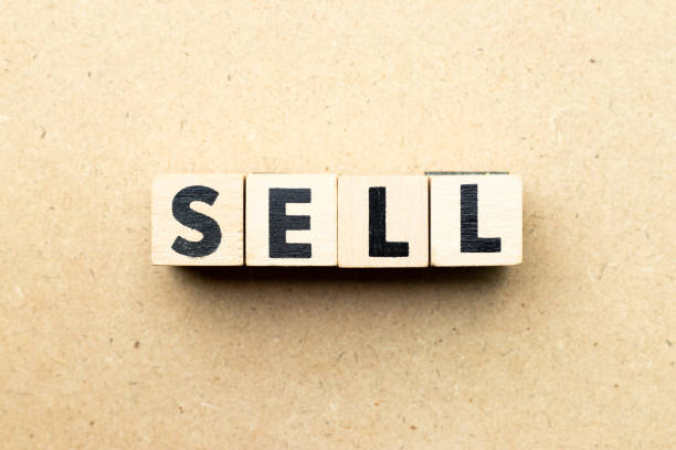 istock Letter block in word sell on wood background 1209906199