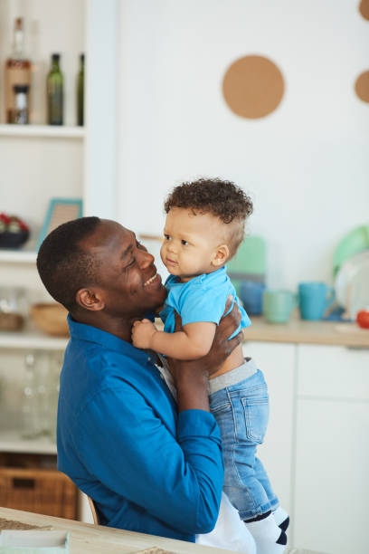 istock Loving Father Embracing Baby Son 1209906750