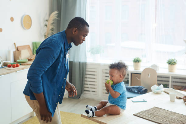 istock Father Trying to Calm Crying Baby 1209907512