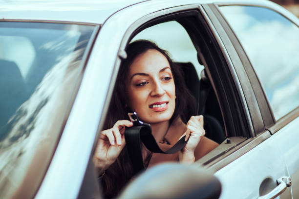 istock Young woman driving car 1209907896