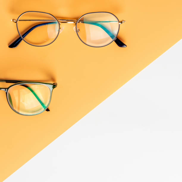 istock Glasses on a yellow and white background, top view 1209908448