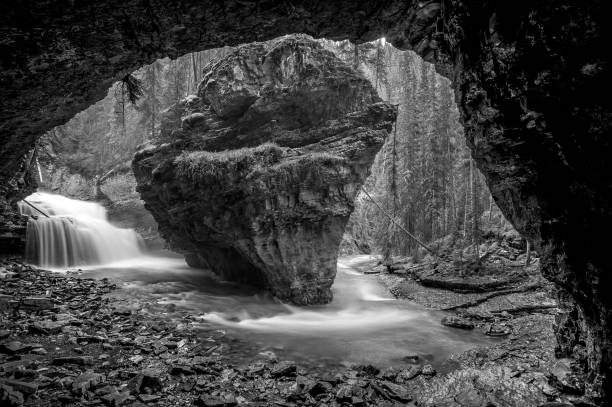 istock Rock, Grotto and Waterfall, Johnston Canyon, Banff, Alberta (B&W) 1209910967