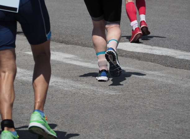 istock Running men and women 1209912831