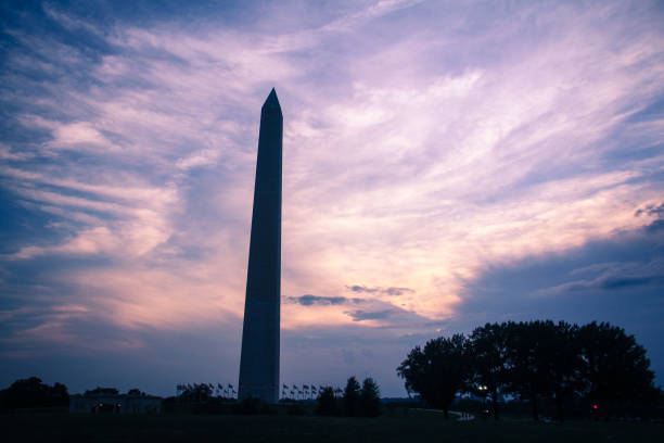 istock Moody sunset behind a silhouetted Washington Monument in Washington DC 1209915186