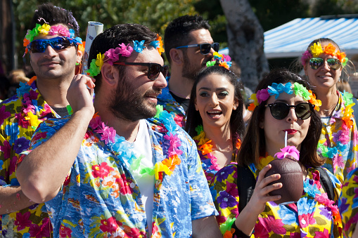 Limassol, Cyprus, March 1st, 2020: Group of people in Hawaiian shirts and garlands taking part in the Grand Parade of the Annual Limassol Carnival Festival