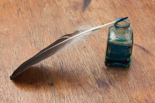 istock quill pen in a glass inkwell 1209918614