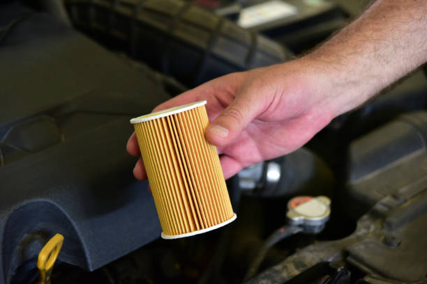 replacement of car oil filter stock photo