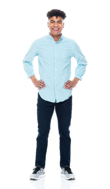 istock Generation z male standing in front of white background wearing button down shirt 1209919216