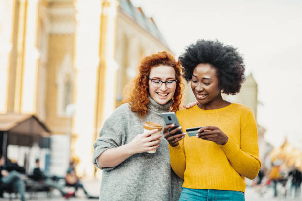 istock Friends doing online shopping 1209920724