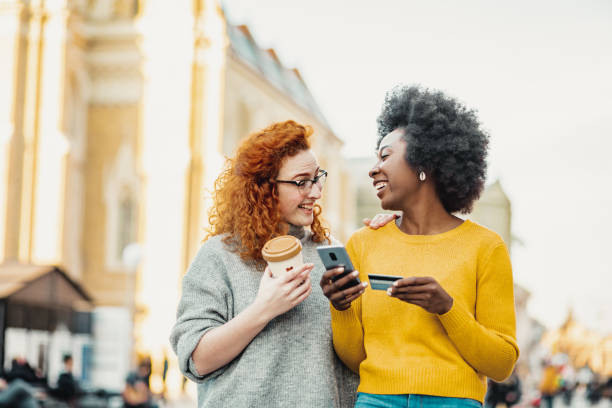 istock Friends doing online shopping 1209920842