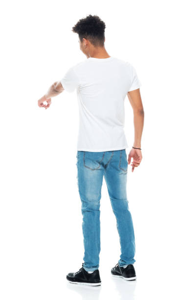 istock Generation z boys standing in front of white background wearing jeans 1209921007
