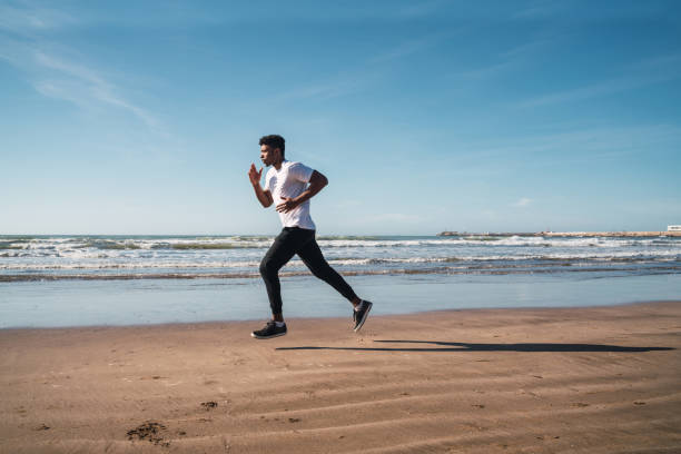 istock Portrait of an athletic man running. 1209921989