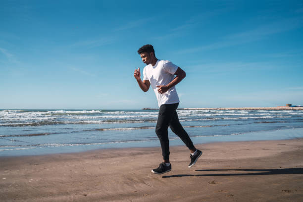 istock Portrait of an athletic man running. 1209921994