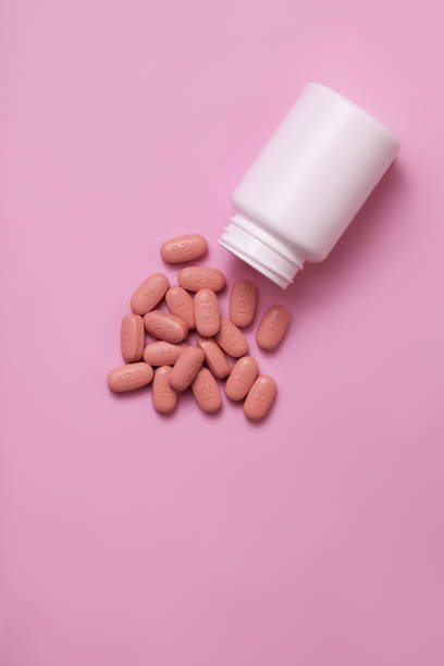 istock HIV/AIDS therapy pills on pink background 1209922637