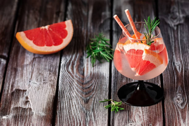 istock Cold cocktail with grapefruit and rosemary. Summer refreshing detox drink. Selective focus. 1209924400