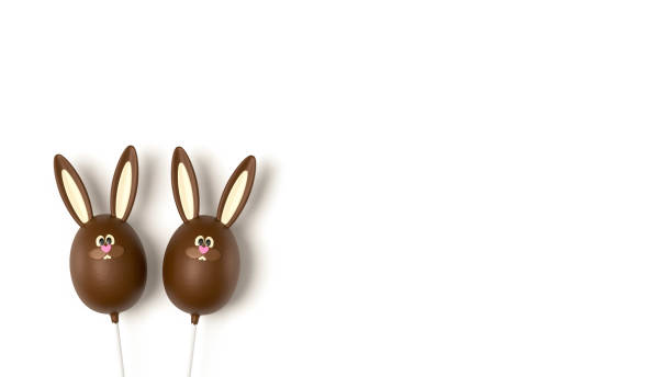 Easter chocolate eggs isolated on white background, top view. Sweet Easter stick candy, chocolate flavour, funny bunny egg. Rabbit bunny dessert, on white table, top view. Rabbit bunny dessert, on white table, top view. Sweet Easter stick candy, chocolate flavour, funny bunny egg. Easter chocolate eggs isolated on white background, top view. chocolate bunny stock pictures, royalty-free photos & images