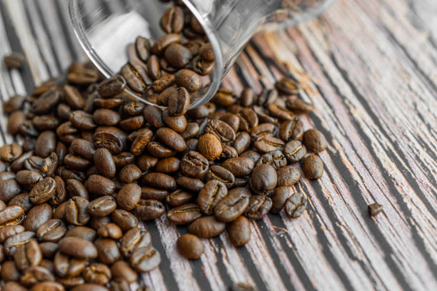 istock Coffee beans, panoramic background image. Wide. Roasted coffee beans isolated on white background. Cafe or gourmet concept with brown coffee beans. 1209926153