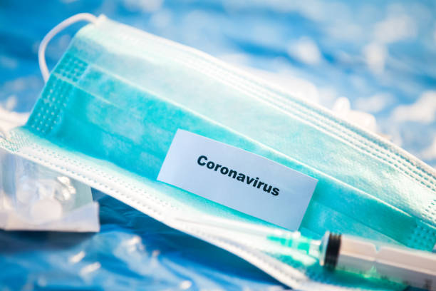 istock Coronavirus vaccines bottles medical background 1209928078