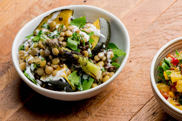 Lentil , Eggplant Vegan Salad. Traditional classic Greek or Turkish lentil salad. Made with fresh lentils boiled in beef stock and tossed with olive oil, italian parsley and seasoned with salt and pepper. ensalada vegana de lentejas, berenjena. ensalada de lentejas clásica griega o turca tradicional. elaborado con lentejas frescas hervidas en caldo de ternera y mezcladas con aceite de oliva, perejil italiano y sazonada con sal y pimienta.