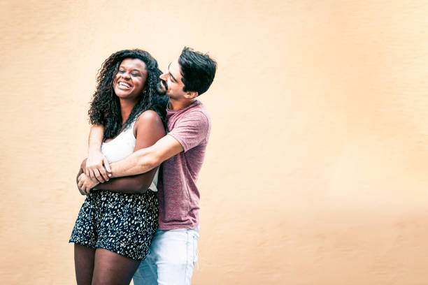 istock White guy hugging his beautifull happy black girlfriend 1209930460