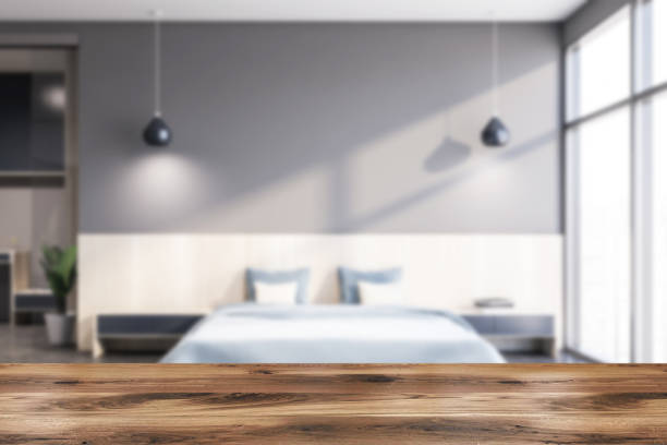 istock Table in blurry gray bedroom 1209931632