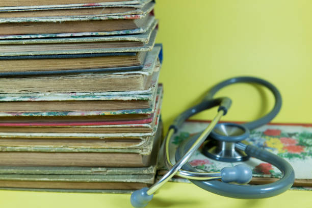 istock Old book retro ancient vintage and stethoscope 1209932994