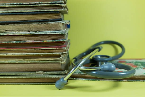 istock Old book retro ancient vintage and stethoscope 1209933152