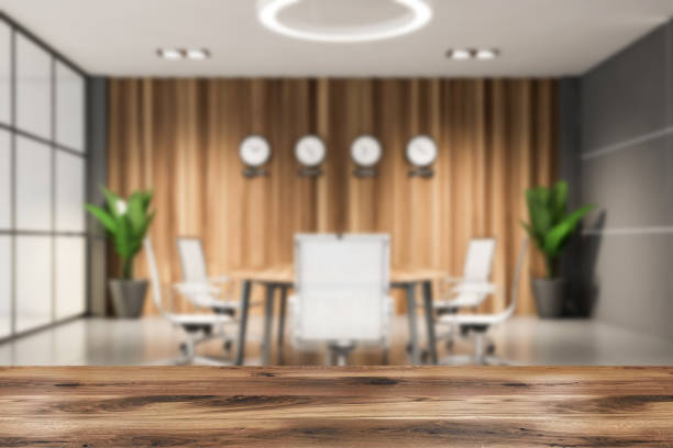 istock Table in blurry wooden meeting room 1209933223