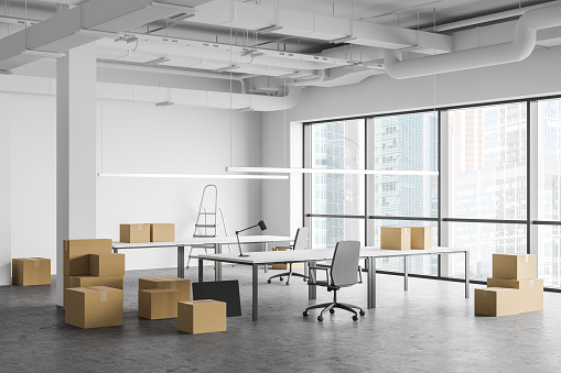Cardboard boxes with equipment in spacious white Industrial style open space office interior. Concept of moving and delivery. 3d rendering