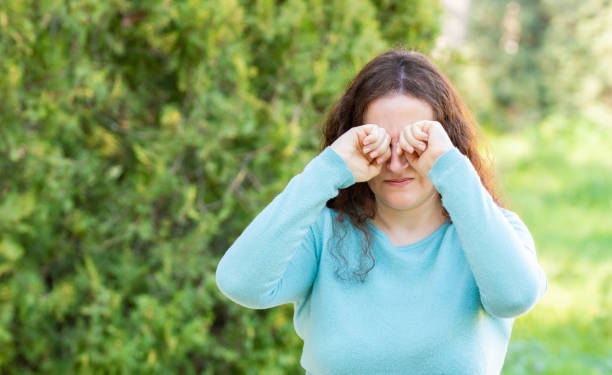 istock Woman suffering itching scratching eyes in a park 1209935062