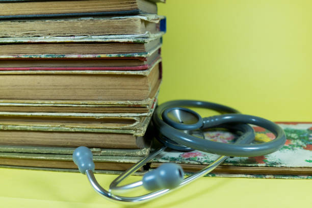 istock Old book retro ancient vintage and stethoscope 1209937313