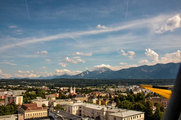 Panorama of the city of Villach with historical churches and a castle in front of the mountains of the Karawanken Mountains in the Austrian Alps Panorama of the city of Villach with historical churches and a castle in front of the mountains of the Karawanken Mountains in the Austrian Alps,Europe villach stock pictures, royalty-free photos & images