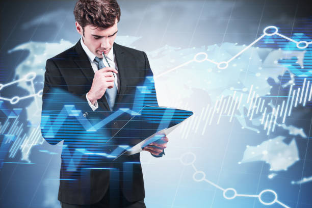 istock Thoughtful man with clipboard, world trade 1209938821