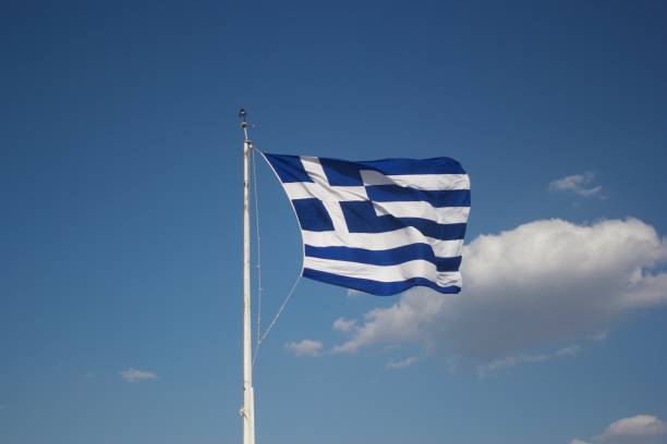 istock Greek Flag in the Wind 1209938855
