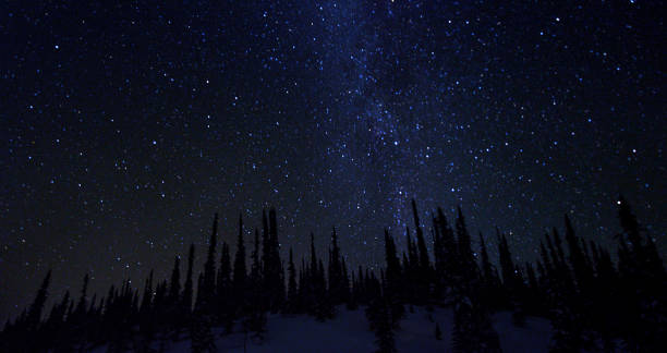 istock Starry sky in the winter in the mountains. 1209943713