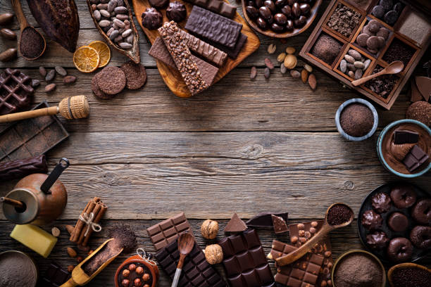 istock Assorted chocolate products with bars cocoa beans nuts spices rustic 1209944541
