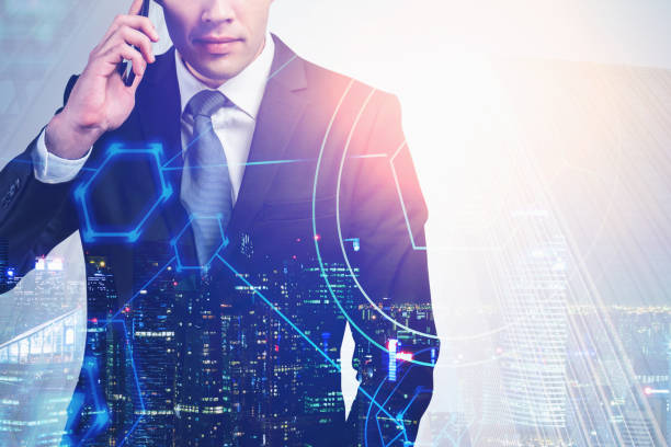 istock Businessman on phone in city, network 1209944601